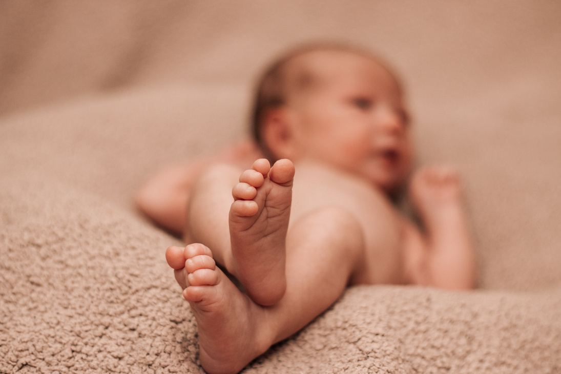 Close Up Photo of New Born Feet